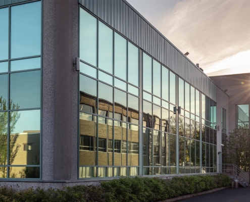 Side view of a commercial building at sunset or sunrise