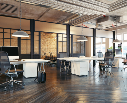 Side view of a commercial office space with computers