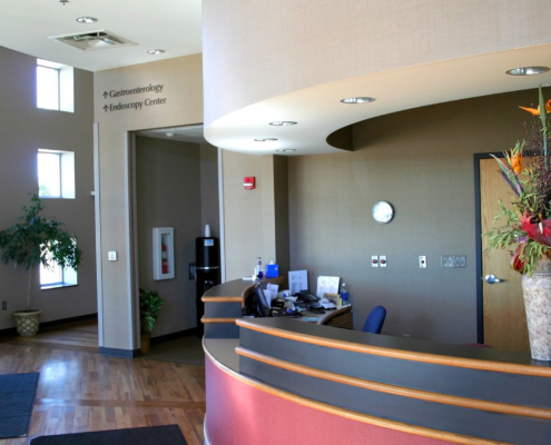 Side view of a hospital lobby desk and hallway