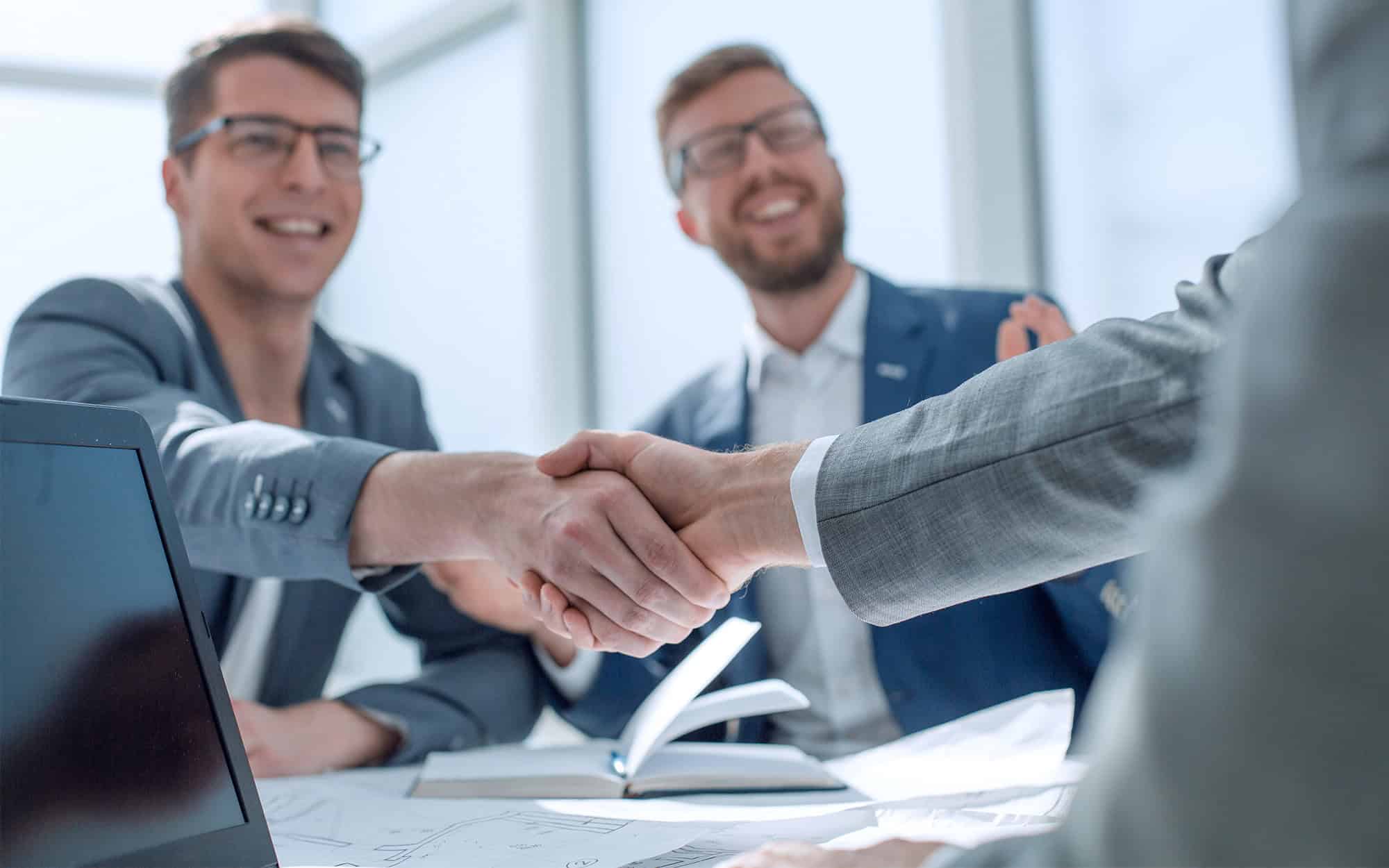 Side view of two businessmen shaking hands