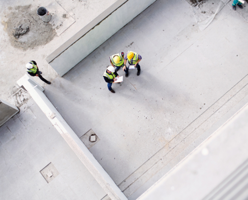 Overhead view of construction workers engineers at construction site